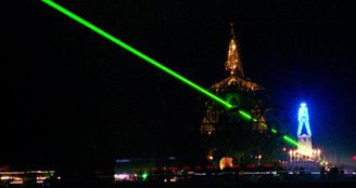 Green laser in sky at night in Black Rock City