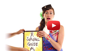 a stewardess holds a card that says "survival guide"