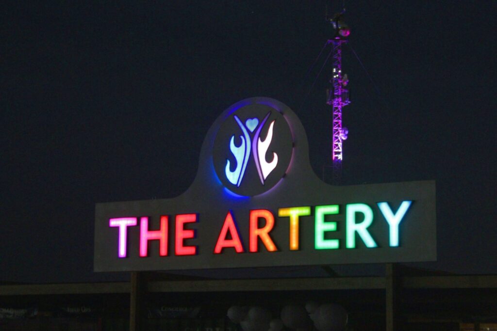 A brightly colored sign that reads THE ARTERY