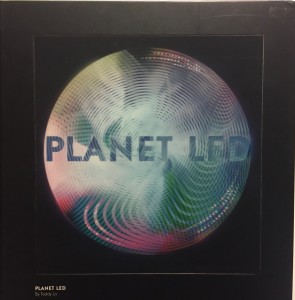 An orb of green and red swirly colors