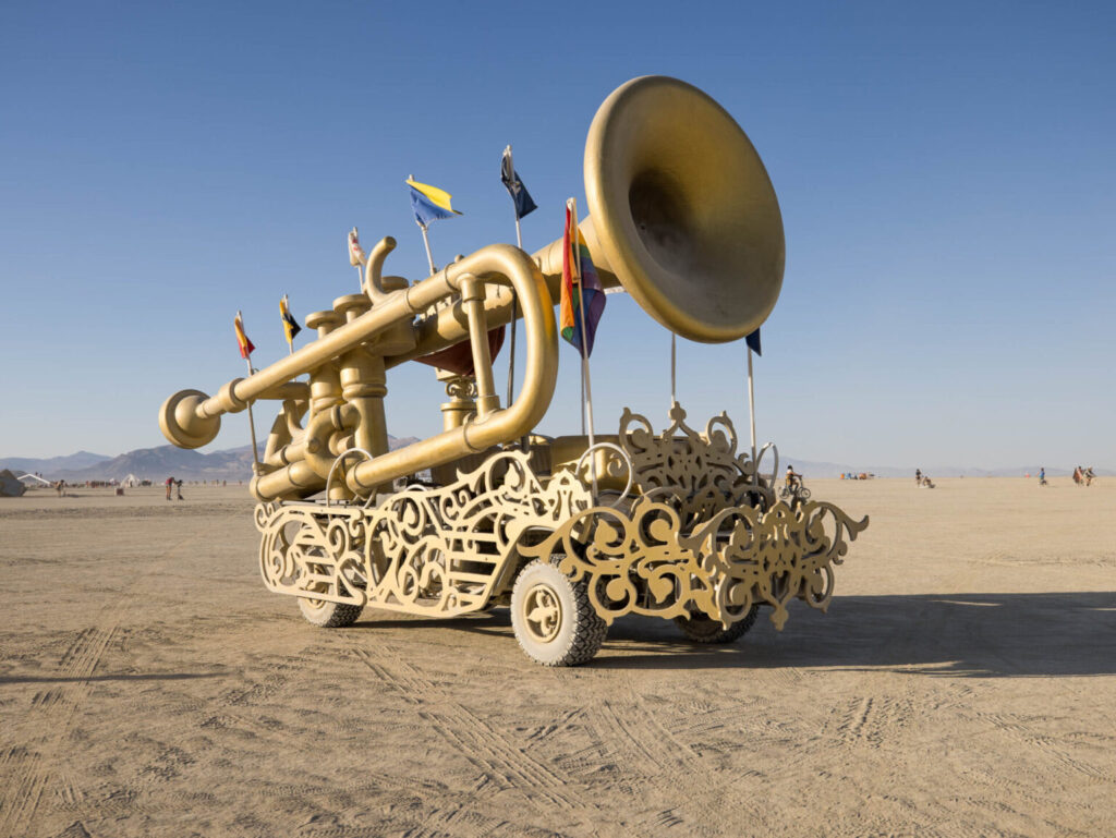 A mutant vehicle in the shape of a trumpet at Burning Man 2022.