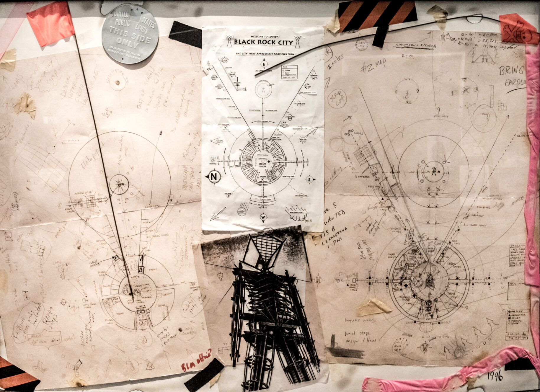 Paper hand-drawn maps and sketches from the early days of Burning Man