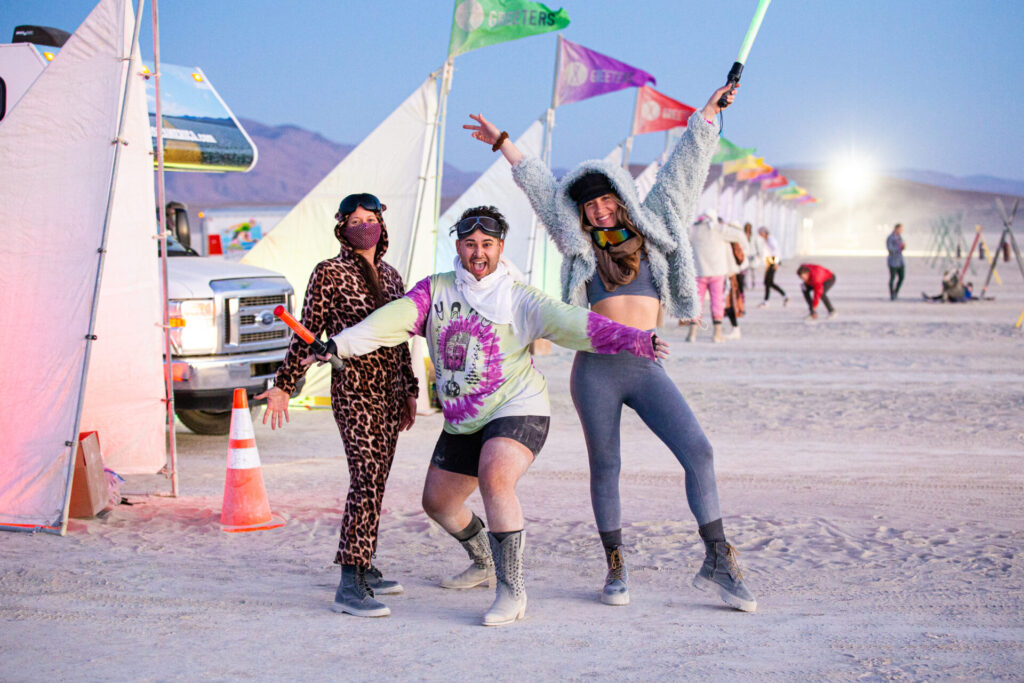 Greeters posing at Greeter station at sunrise.