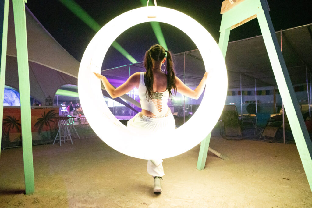 Woman Swinging in a glowing ring