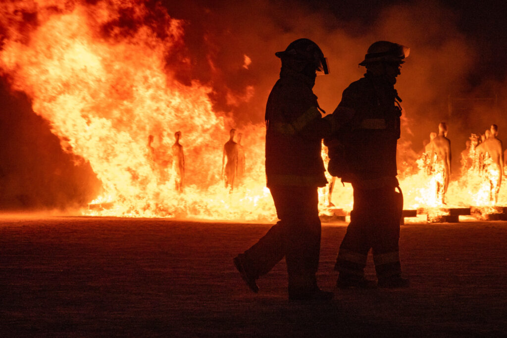 The Burning of The Man's Army is guarded by Fire volunteers