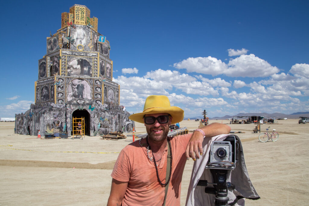 Michael Garlington with his "Chapel of Babel" and the 4x5" Super Graphic view camera he uses to make the large-format photographs he incorporates into his installations, in collaboration with his life partner Natalia Bertotti.
