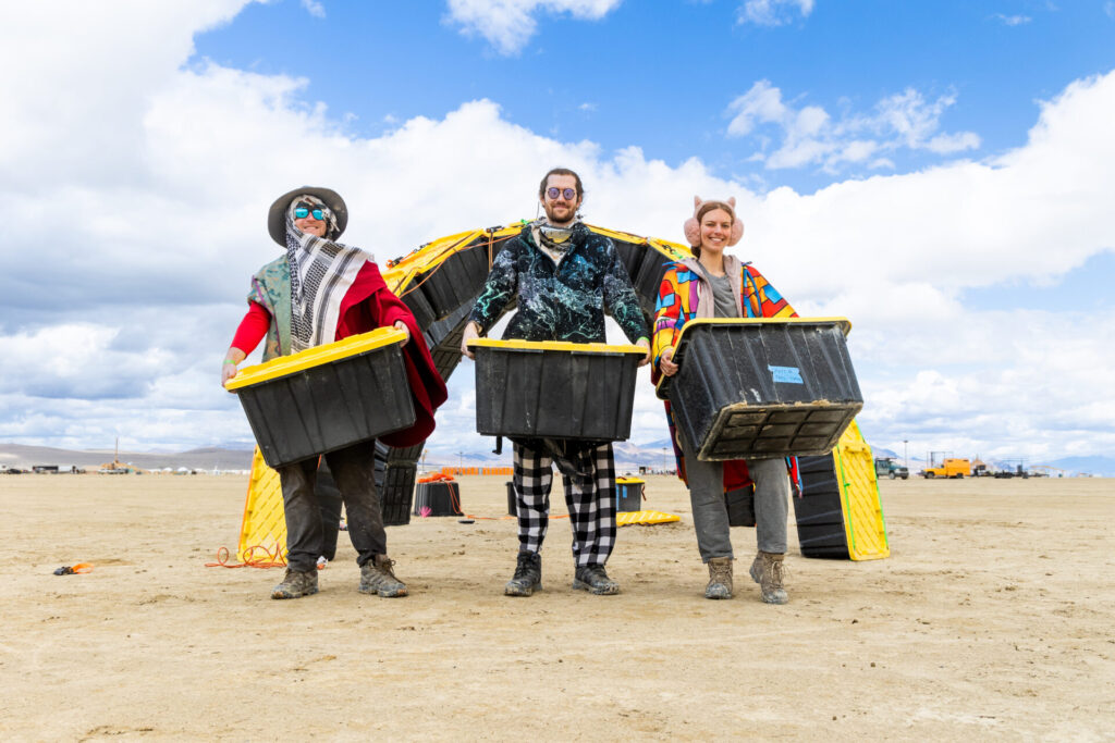 Three burners holding black and yellow crates