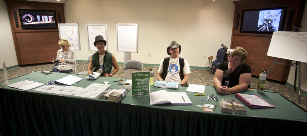 Volunteer staffers greet Burners arriving by air at McCarren Airport in Reno, Nevada, providing information and facilitating ride-sharing to the Playa. (Photo by George Post)