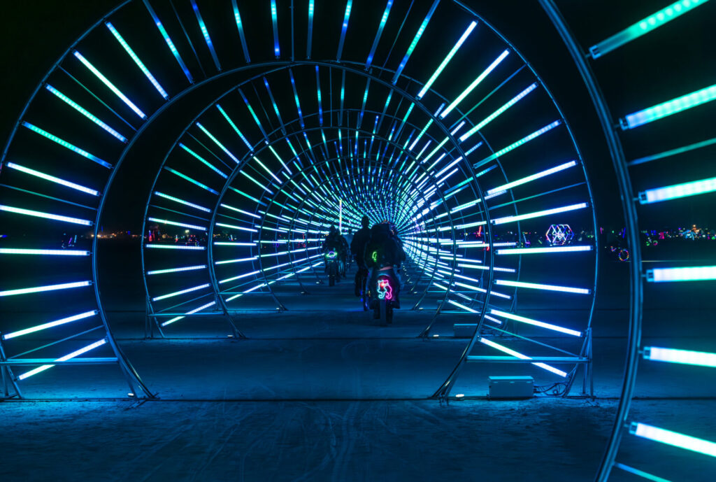 A tunnel with LED stripes extends into the distance