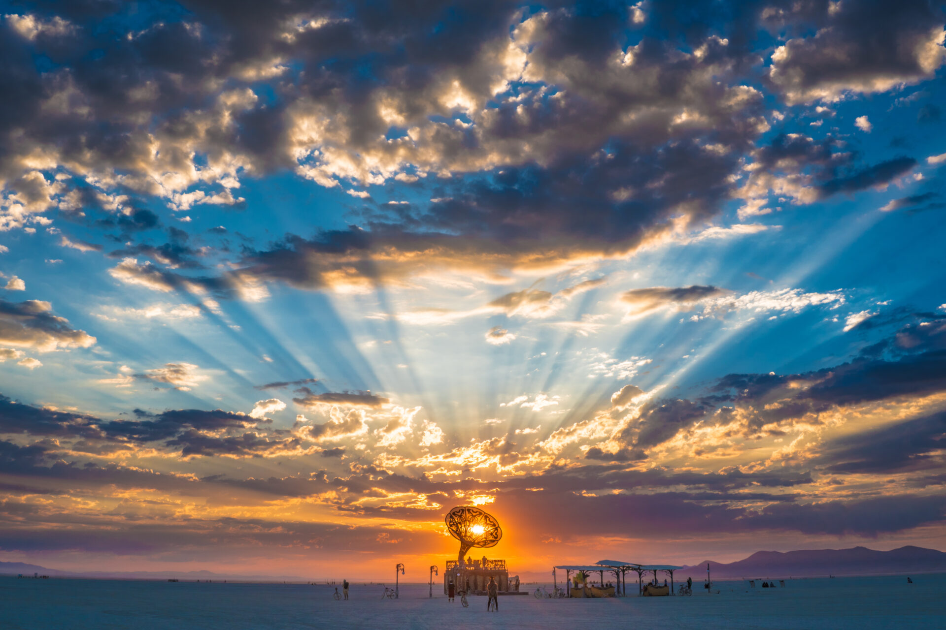 Beams of sunlight at sunrise behind La Victrola