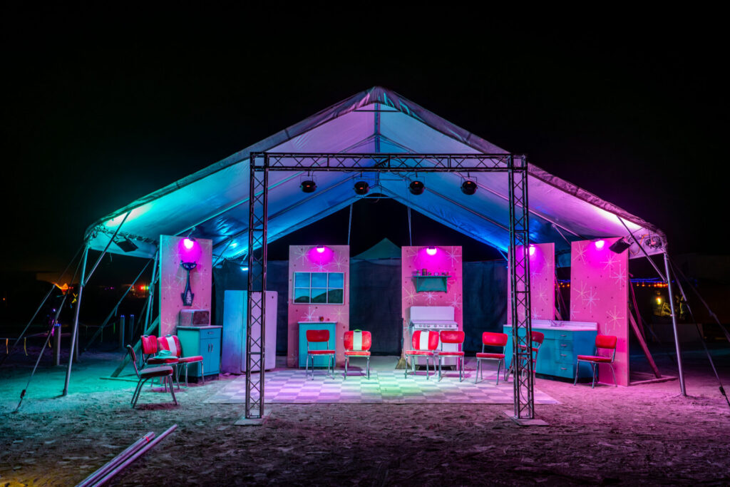 Very cool 1950's Mid-Century Modern Esplanade facing camp of mostly hearing impaired campers. Large shade structure with pink and purple lighting.