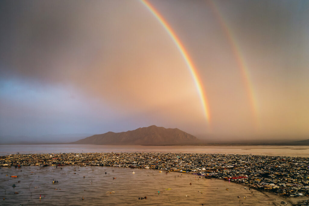 Double rainbow over the mountains and Black Rock City