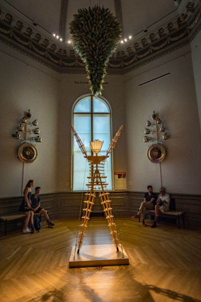A man effigy sculpture installed in a gallery