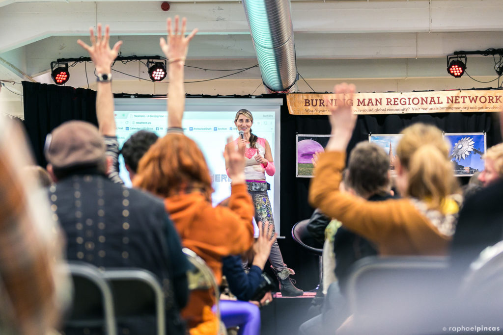 Shirin Nikpay speaking to a group at a Burning Man Regional Network Summit.
