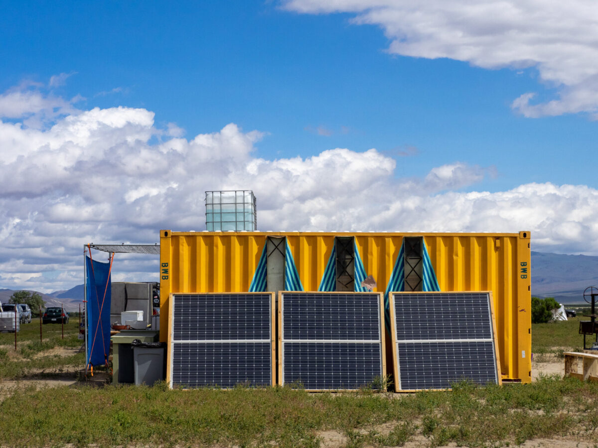 A shed with solar panels intended for artists to recharge their project batteries.
