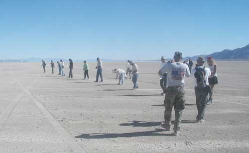 Volunteers inspect and clean the playa.