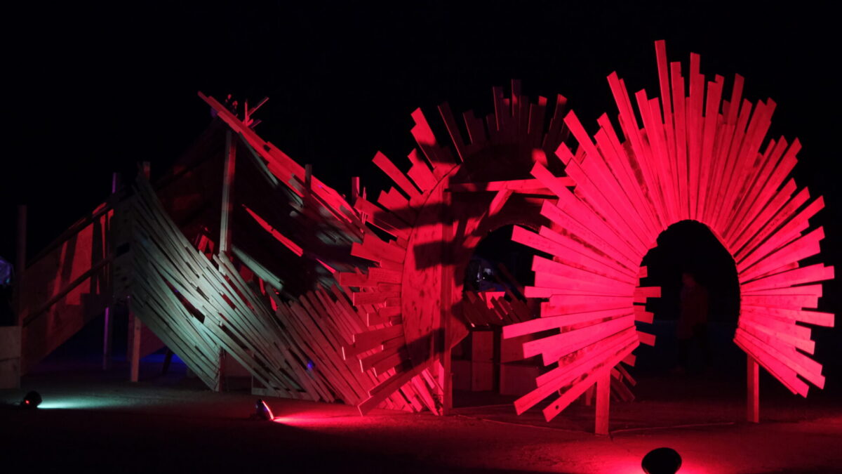 The effigy lit with dramatic red spotlights