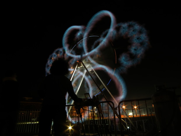 A visitor directs the action of Christopher Schardt's fire sculpture, Pyroticulation, at BRAF's Twilight at the Presidio event, October, 2013.